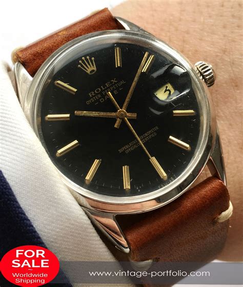 rolex oyster black dial gilt